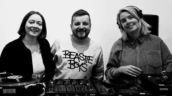 Black and white photograph of three members of Good Afternoon v