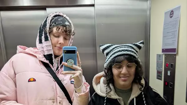 yyre and fkahardcore taking a selfie in a lift mirror