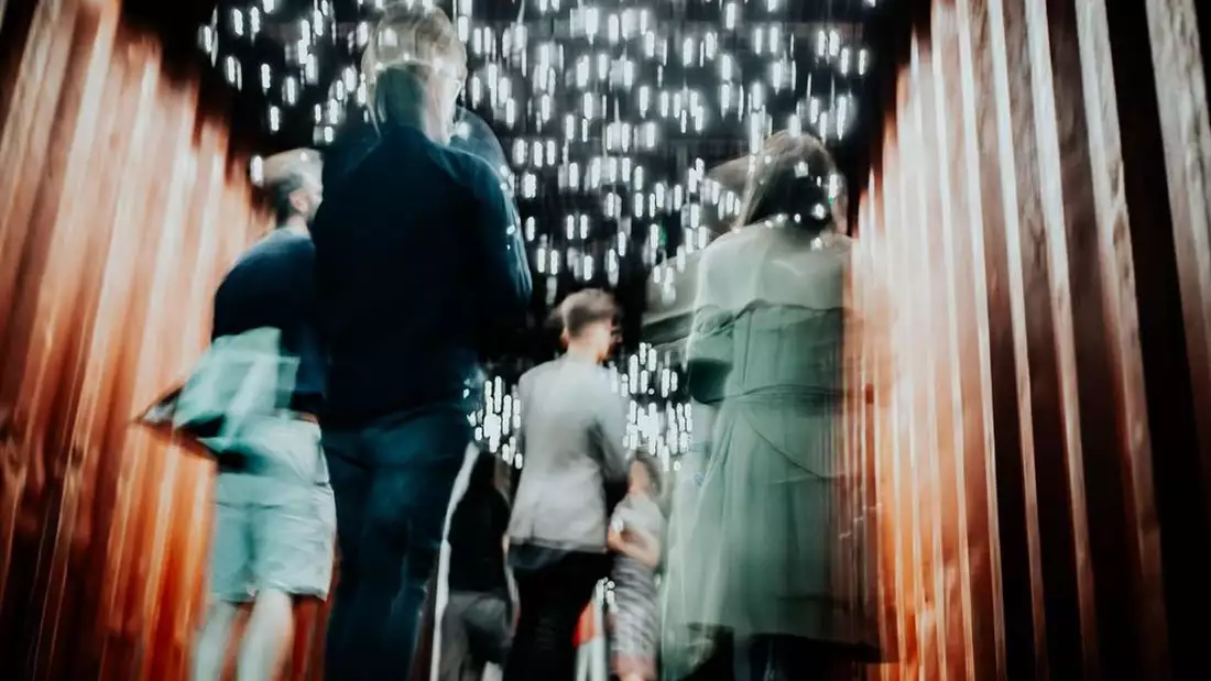 A blurry and atmospheric image of people at MIF