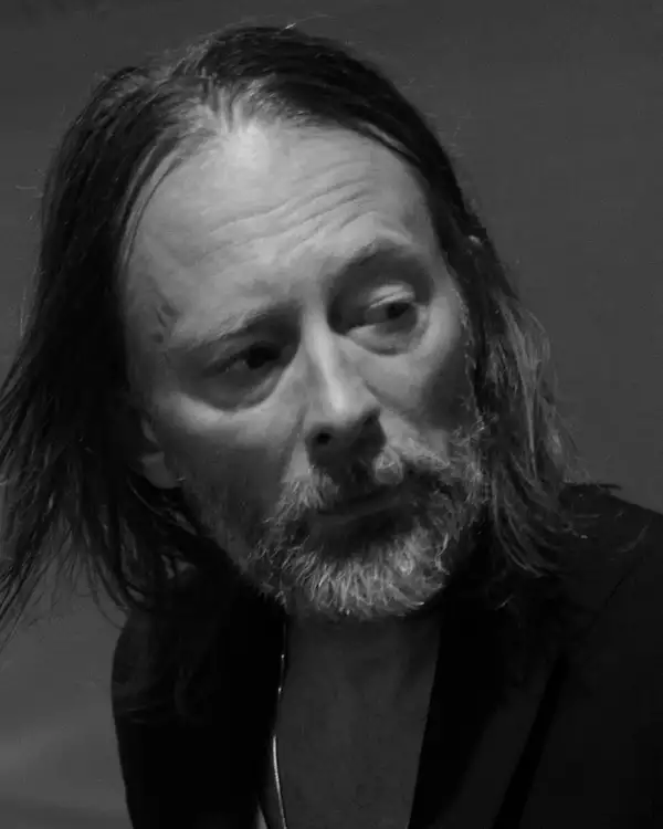 Black and white headshot of Thom Yorke looking to the side