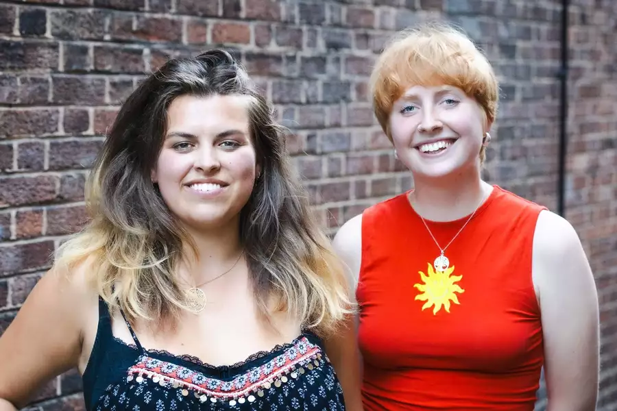 Duo Watson & Lockett posing for a photo smiling