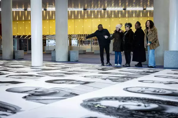 Inside Out black and white portraits on the ground outside Aviva Studios