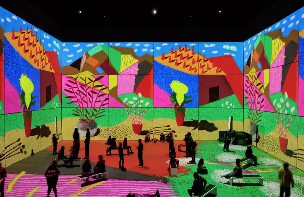 People inside the Bigger & Closer exhibition at Aviva Studios