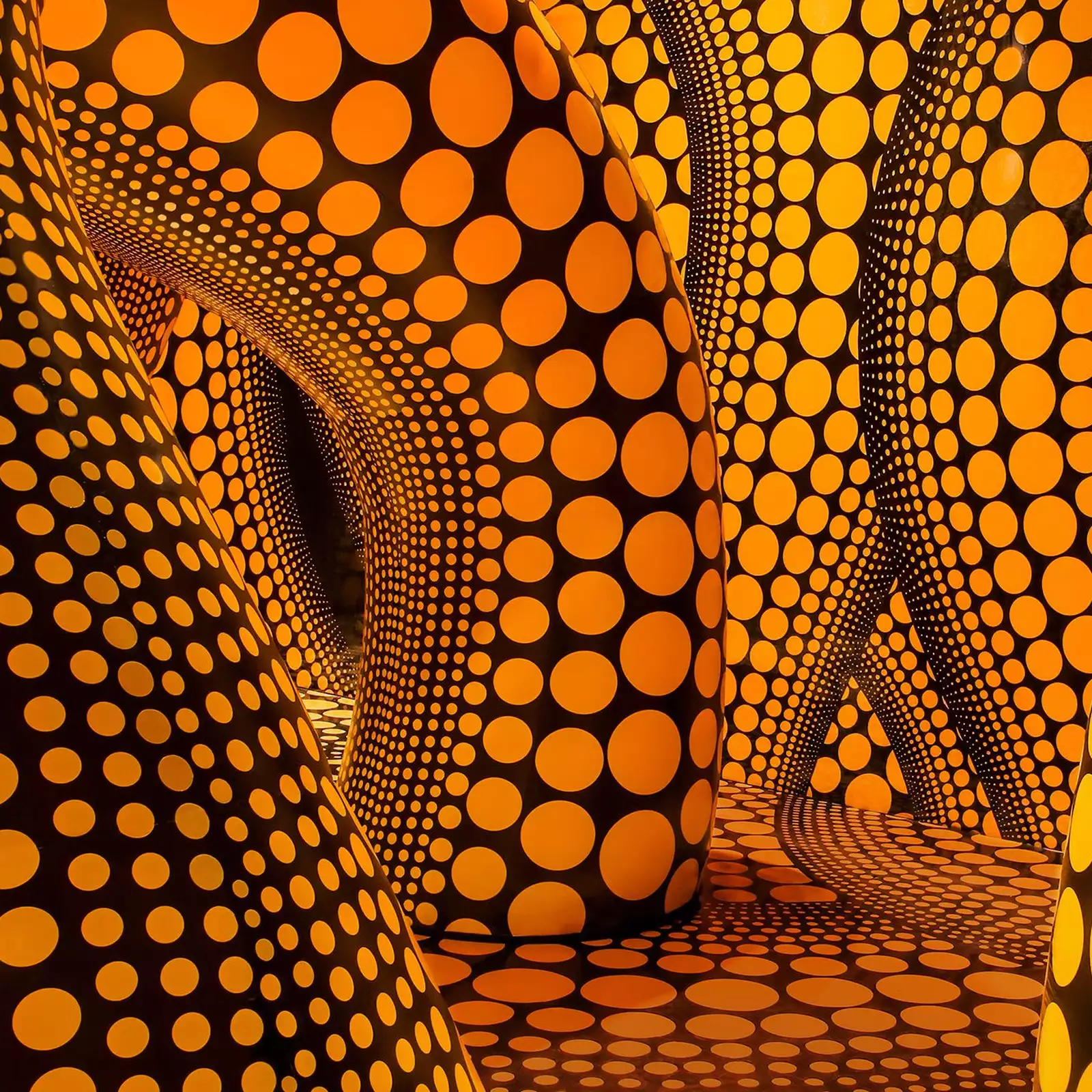 Yayoi Kusama artwork of large inflatable yellow tentacles with black polkadots on them