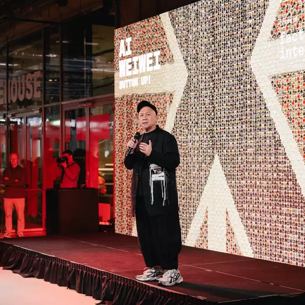 Kee Hong Low stood on the stage in the Social speaking into the microphone