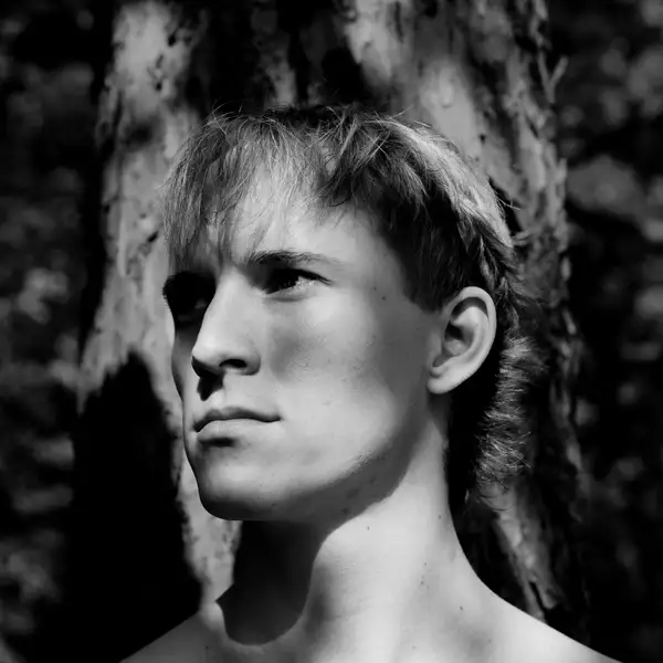 Black and white headshot of Rowan Schratzberger