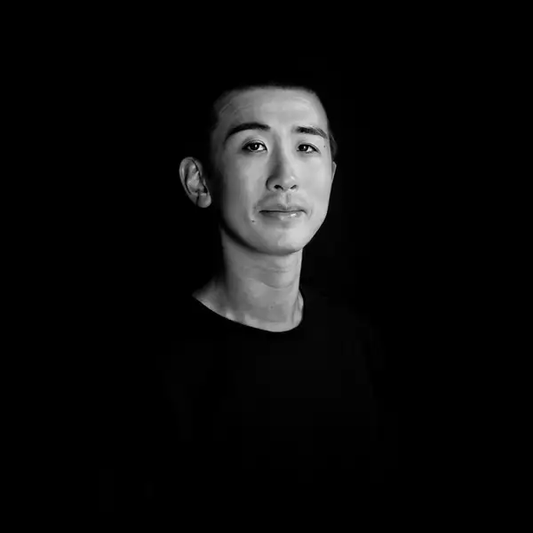 Black and white headshot of Billy Zhao