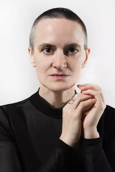 headshot of Amy Miller on a white background, wearing a black top