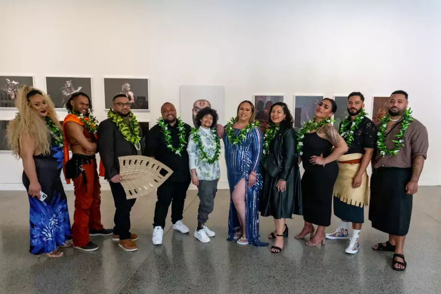 A photo of the artists in FAFSWAG collective standing in Māngere Arts Centre in front of a white gallery wall