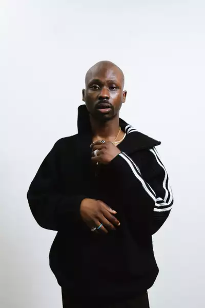 Pelumi Fatayo wearing a black Adidas jacket