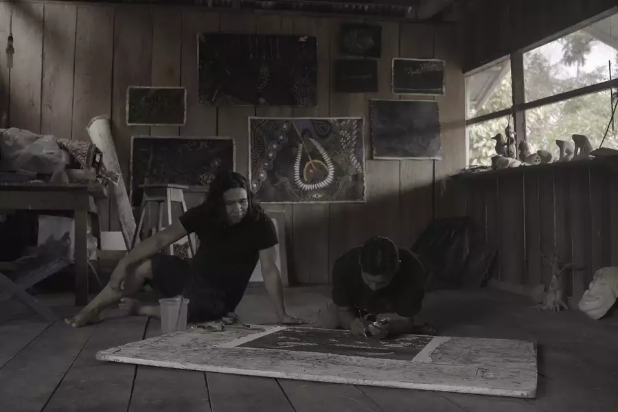 A still of artist Rember Yahuarcani from the film El Canto de las Mariposas