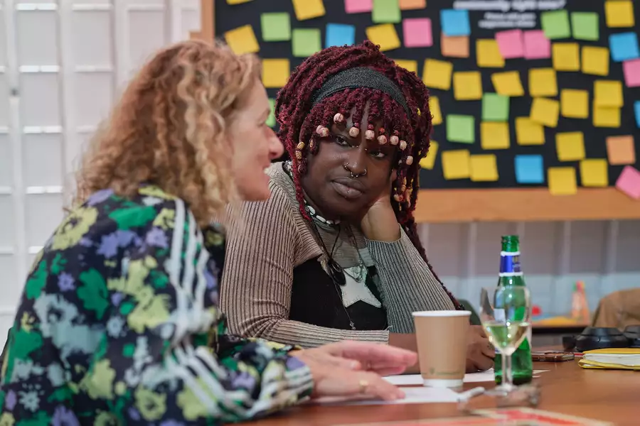 Two people engage in conversation