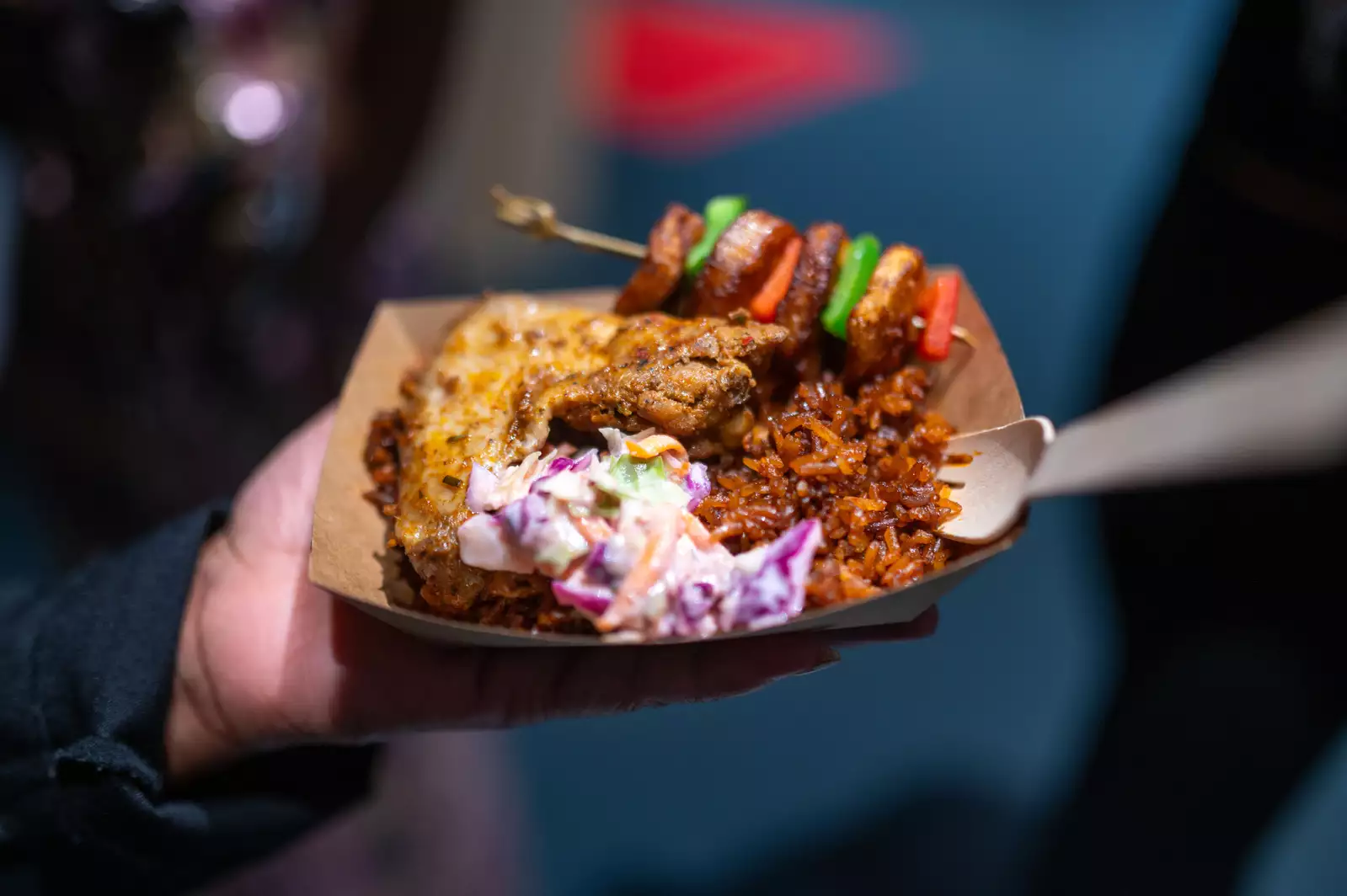 A tray of food – a kebab, rice and coleslaw