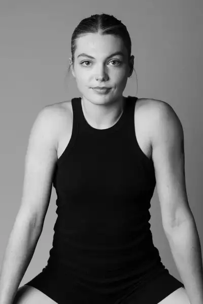 Black and white headshot of Maya Davies