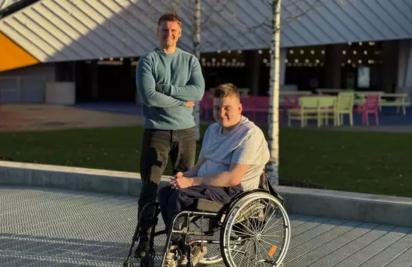 Beck and Jimmy Royals outside Aviva Studios on a sunny day