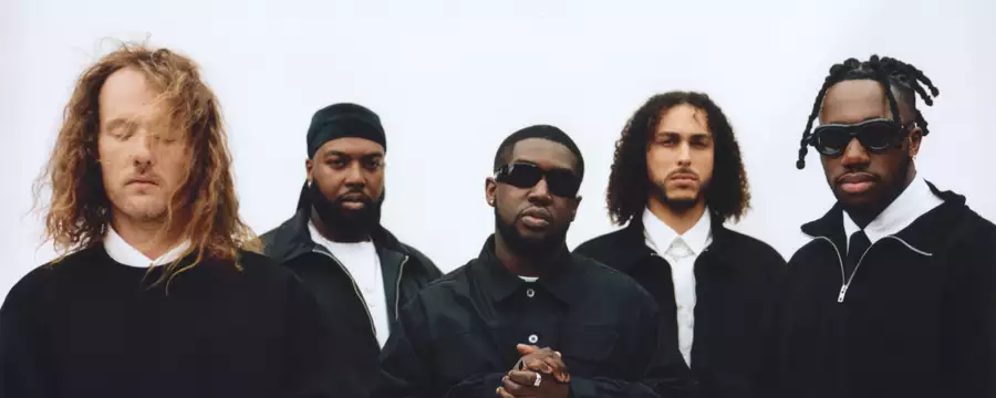 Five members of Ezra Collective on a white background