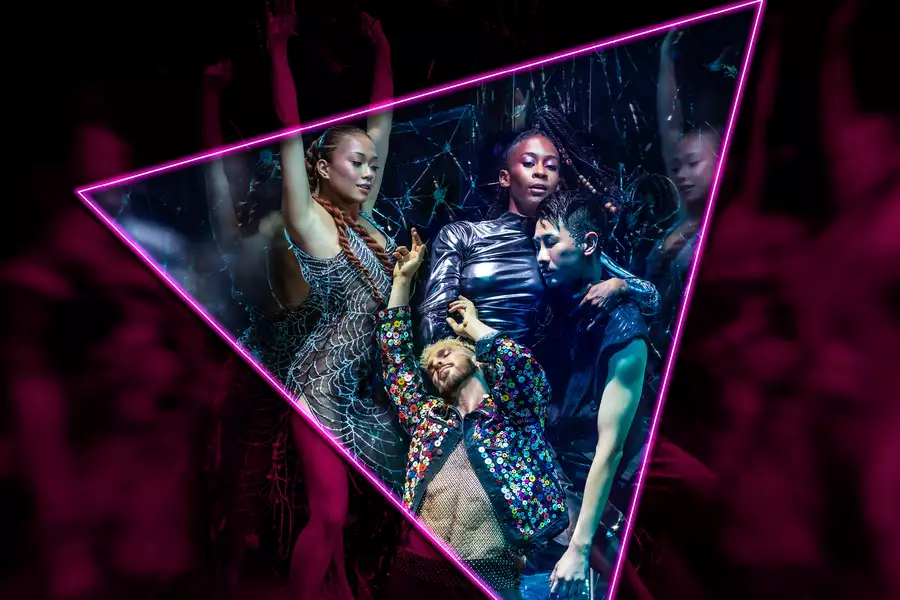 Neon-lit dancers posing inside a glowing triangle frame at a nightclub.