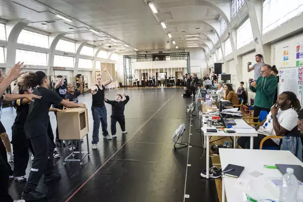 The rehearsal room for Free Your Mind with the creative team watching the dancers
