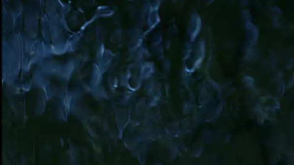 This image has an abstract, fluid-like pattern with dark blue and black tones, creating a sense of flowing water or rippling textures.