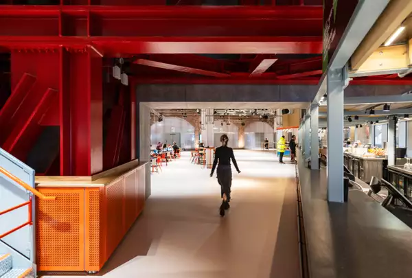 Photo of a visitor walking into the Social