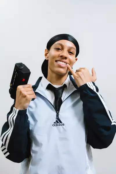 Letitia Colling wearing a light blue and black Adidas jacket