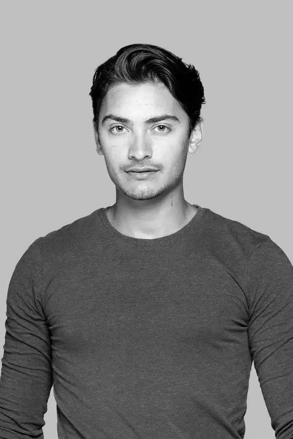 Black and white headshot of James Stephens wearing a long-sleeved top