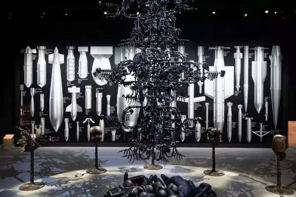 A view of La Commedia Umana – a giant, black chandelier – in the exhibition
