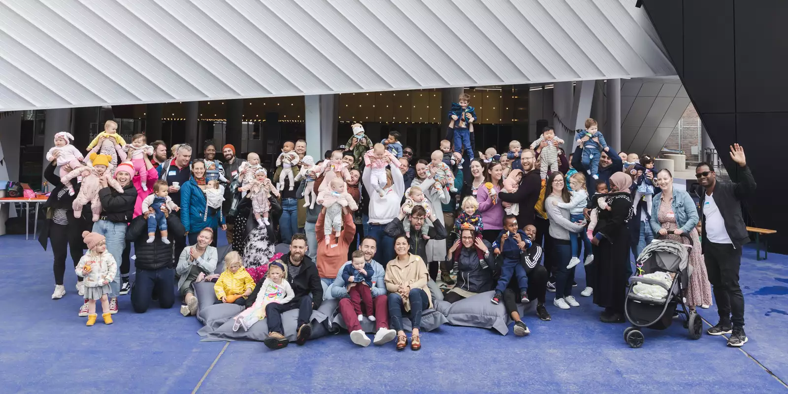 Group photo of the first breath families outside Aviva Studios