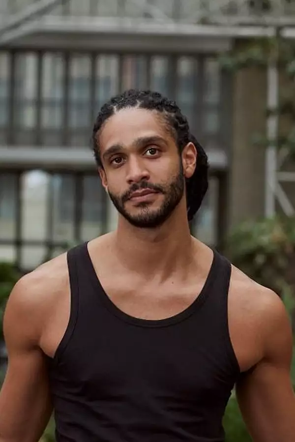 Headshot of Harry Alexander wearing a black vest