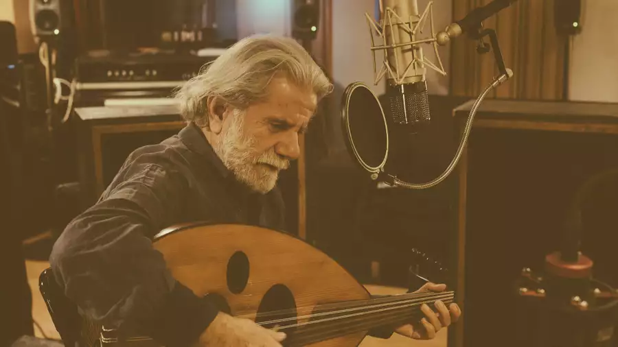 Sepia image of Marcel Khalifé playing the oud
