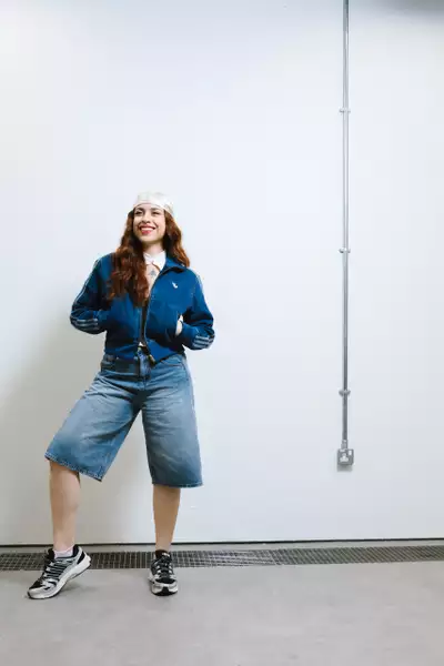 Farah Khalil wearing a denim Adidas jacket and shorts