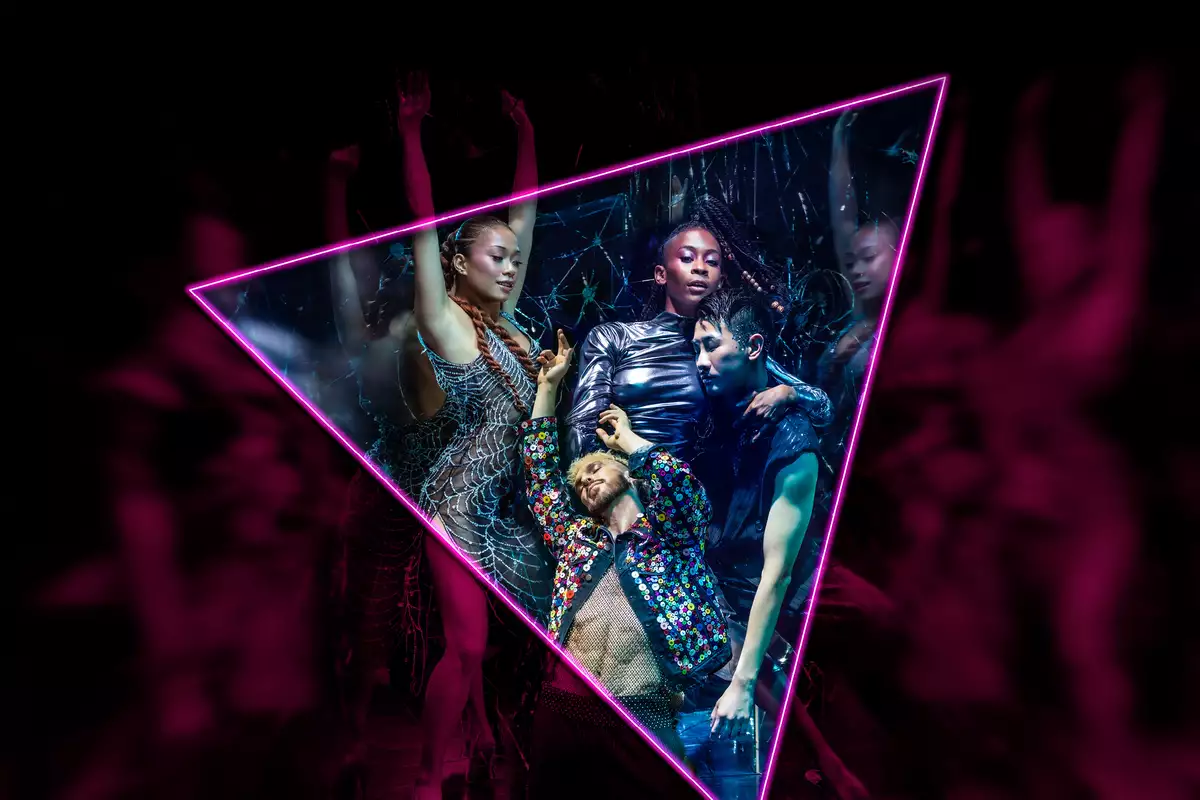 Neon-lit dancers posing inside a glowing triangle frame at a nightclub.