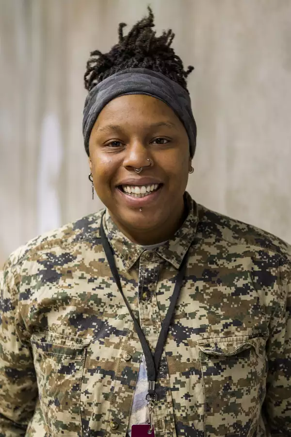 Portrait photograph of Sophia Sanderson wearing a brown patterned shirt
