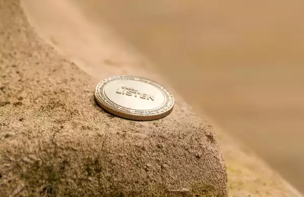 A coin from Ryan Gander's 'The Find' placed on a stone wall