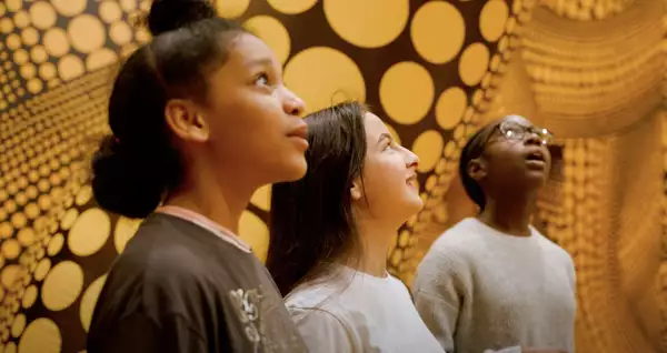School children in a Yayoi Kusama exhibition