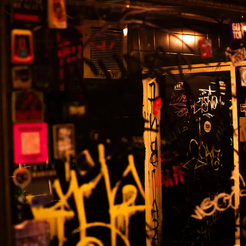 Graffiti on a mirror in the toilets at the DBA