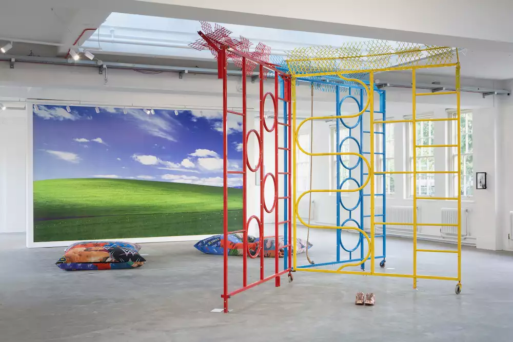 A gallery space showing artworks by Trackie McLeod including a brightly coloured climbing frame