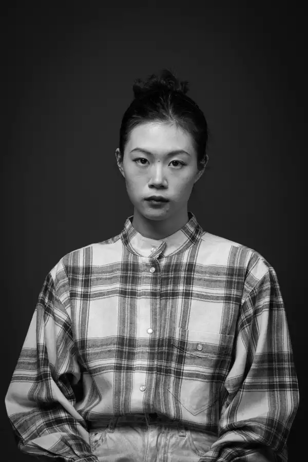 Black and white headshot of Linhao QIN