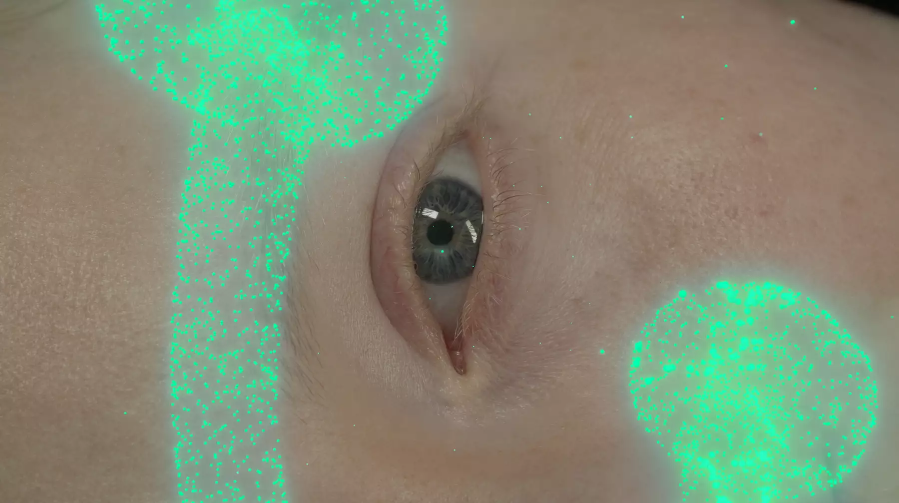 Close up of a white woman's eye. She is horizontal. Green shiny dots make up the shape of long stemmed mushrooms