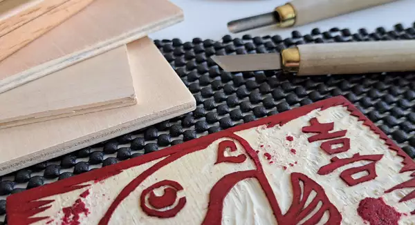 A Chinese woodblock decorated with red colouring