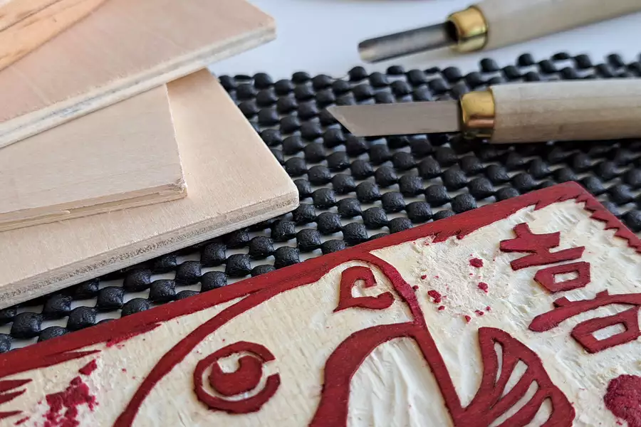 A Chinese woodblock decorated with red colouring