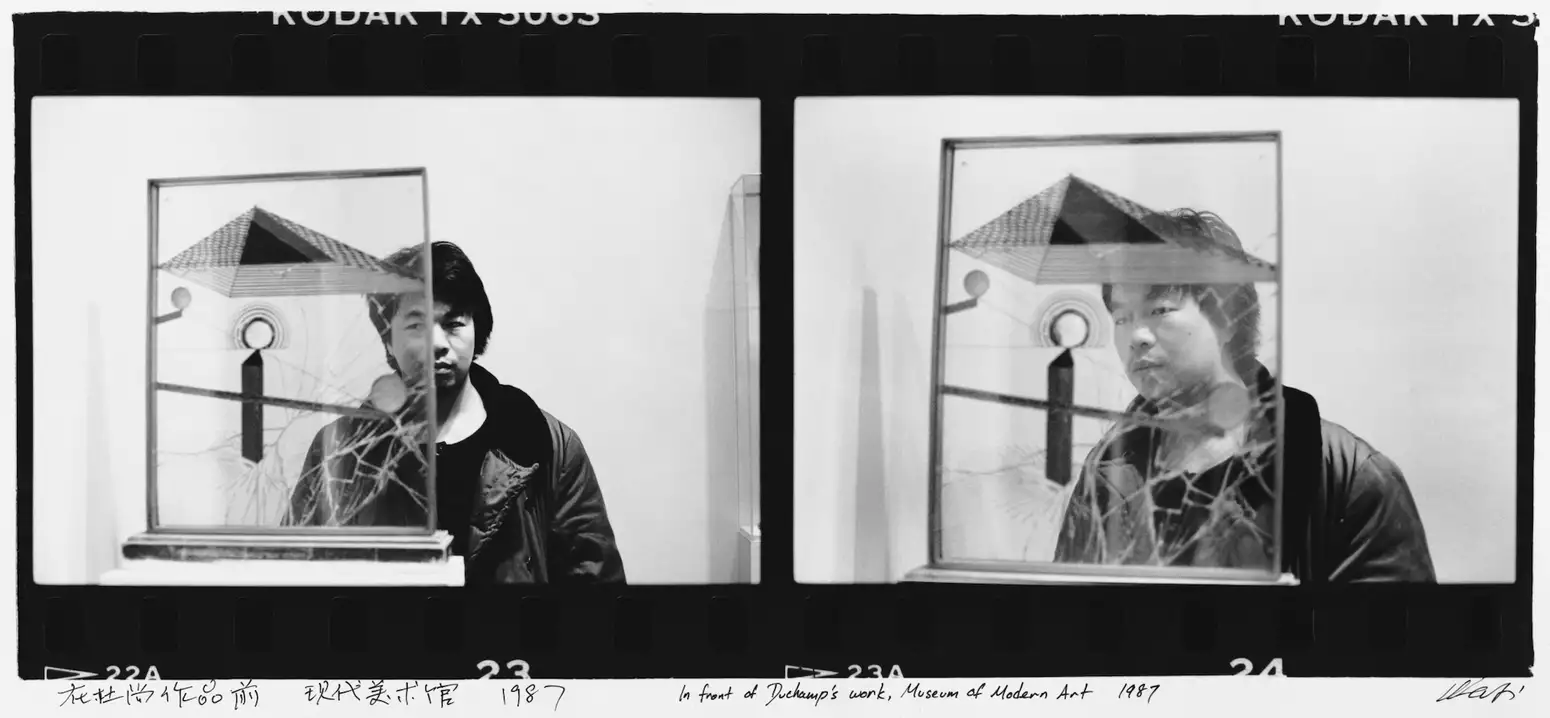 Two black and white photographs of Ai Weiwei stood behind Duchamp's work