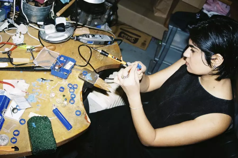 A person in a workshop wax carving
