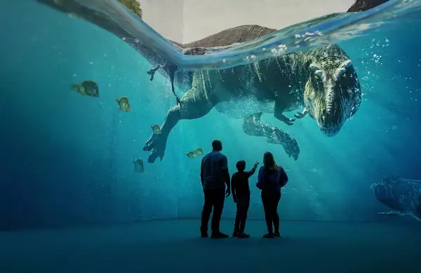 Three people looking at a giant dinosaur swimming in Lightroom