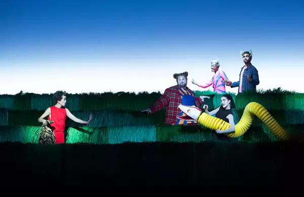 A scene from the stage adaptation of Jungle Book featuring 5 performers in costume