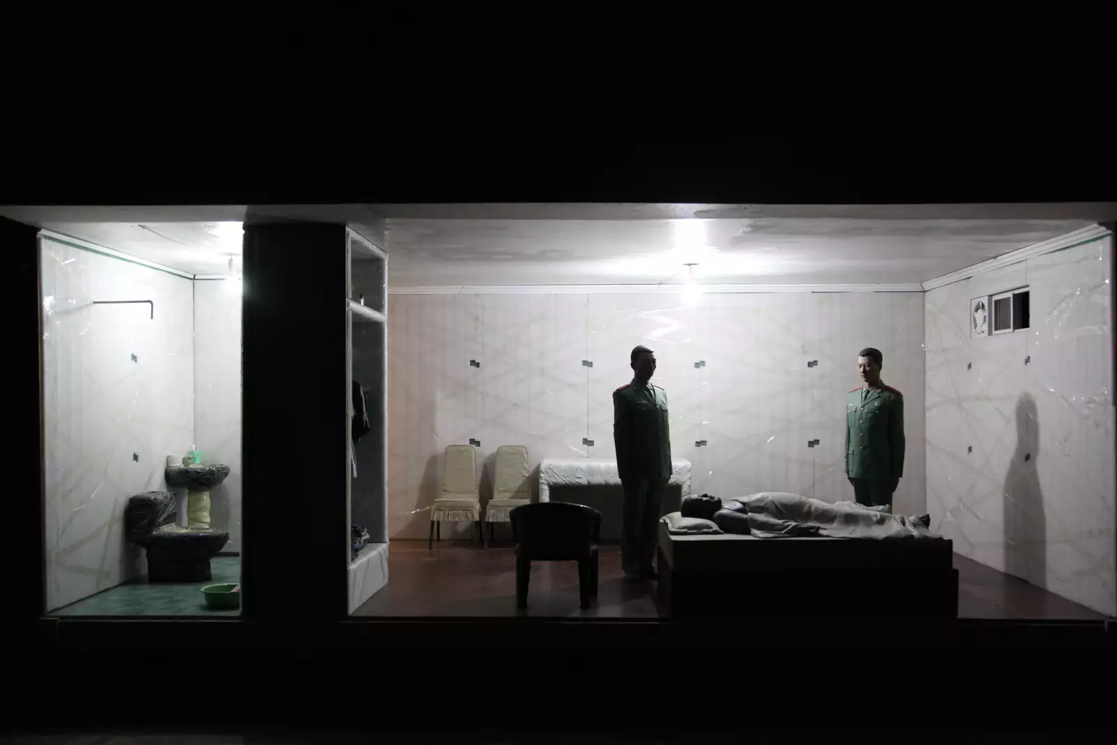 A diorama showing Ai Weiwei in secret detention