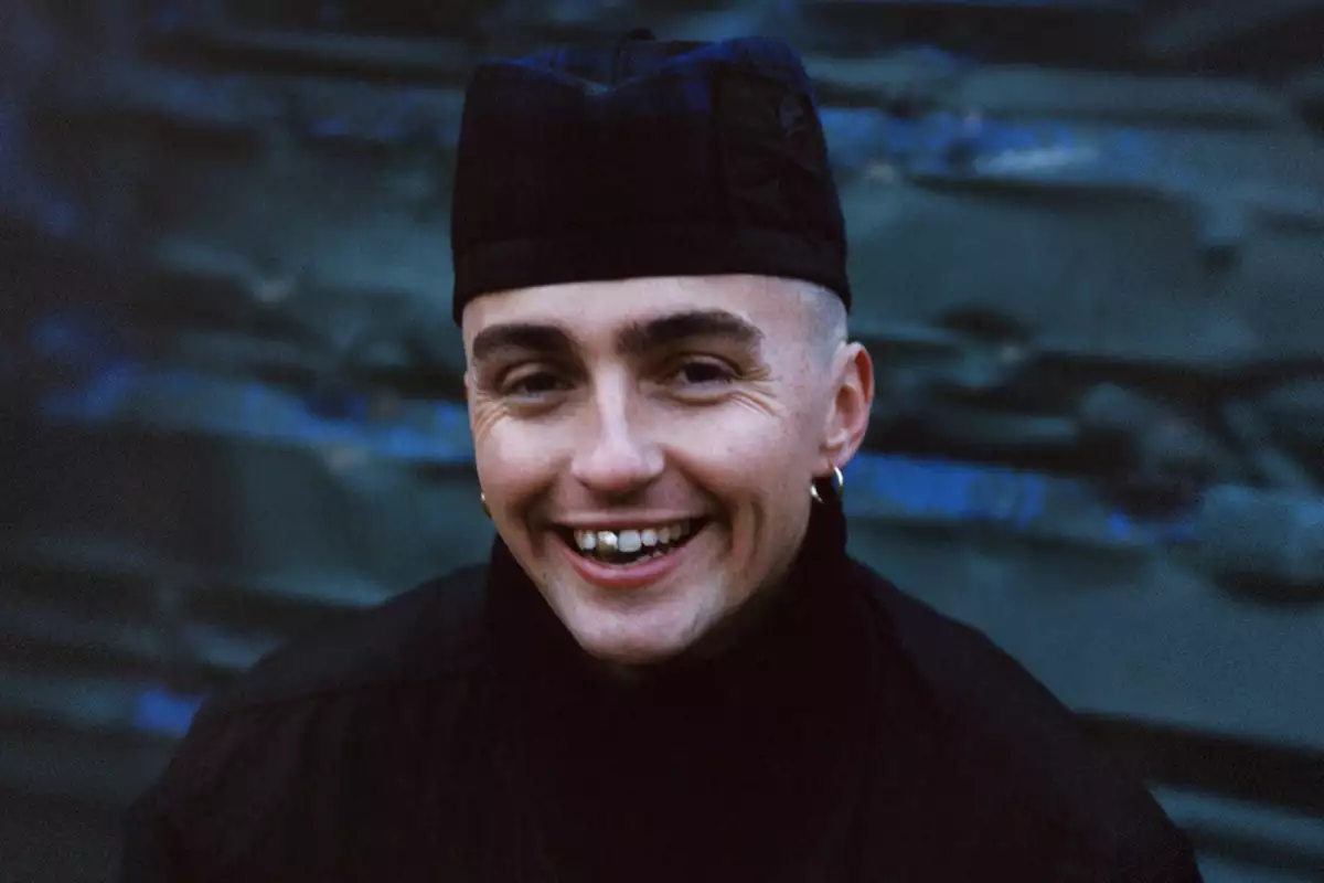 Trackie McLeod wearing all black and smiling