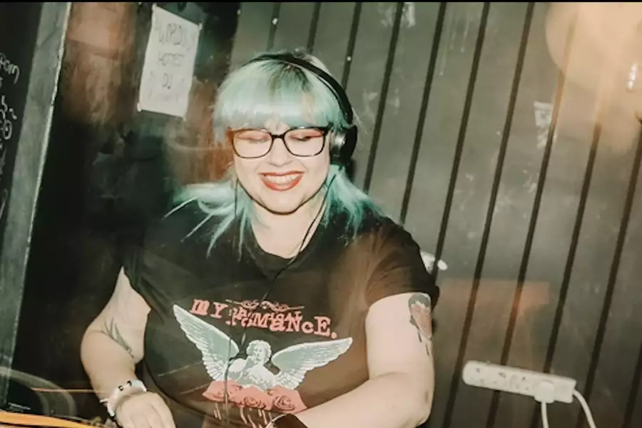 DJ Mx W0rld at a mixing desk