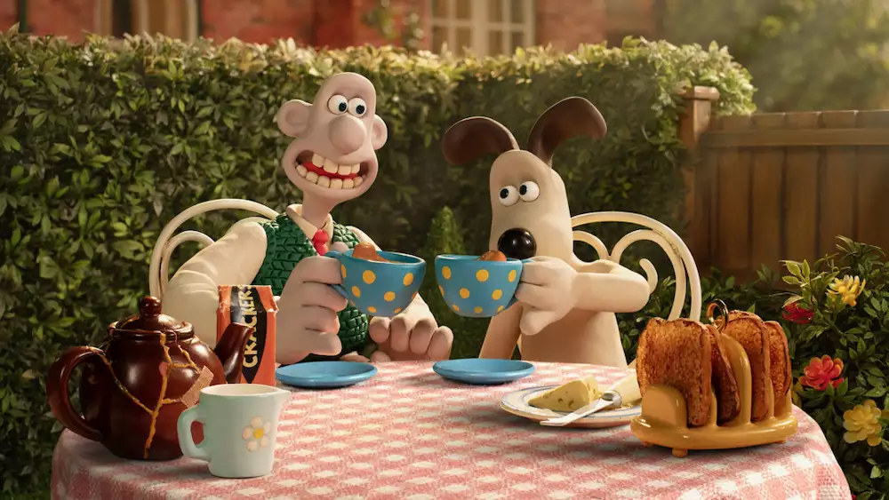Wallance and Gromit drinking tea in the garden