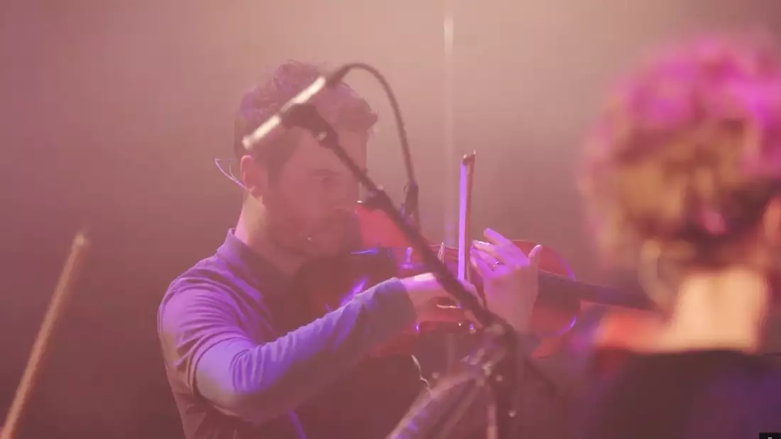 A violinist performing onstage